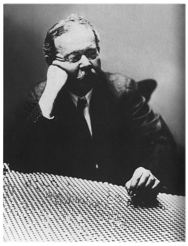 Charles Fort at his super checkerboard (c. 1930).